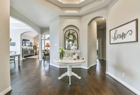 A white table in the middle of a room.