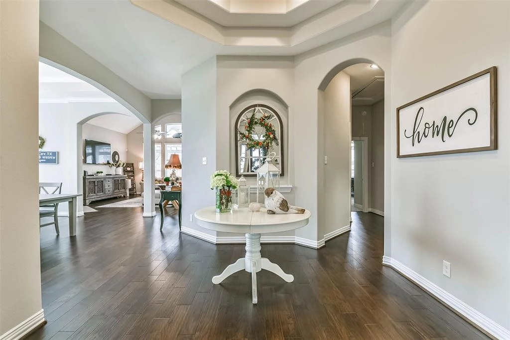 A white table in the middle of a room.