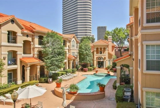 A pool in the middle of an apartment complex.