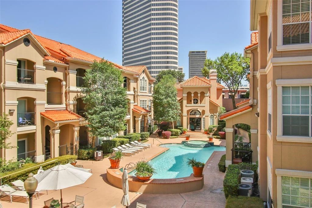 A pool in the middle of an apartment complex.