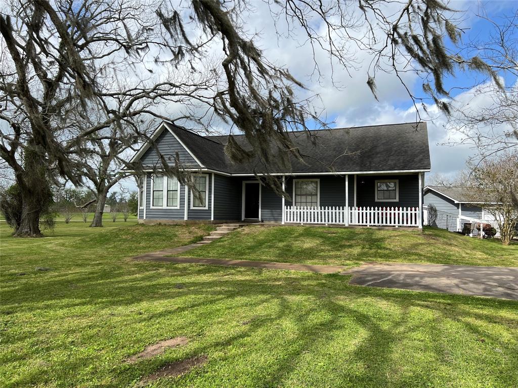 A house with a lot of grass in front