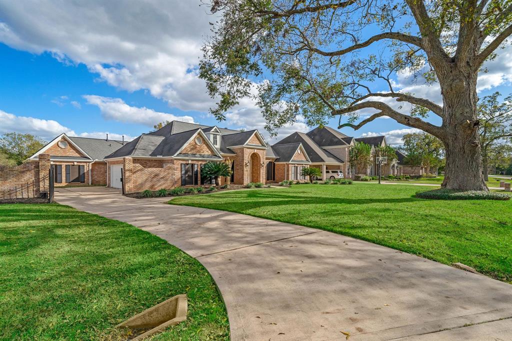 A large house with a driveway in front of it.