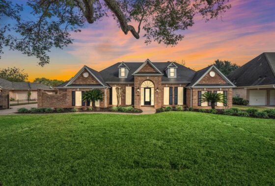 A large house with a lot of grass in front