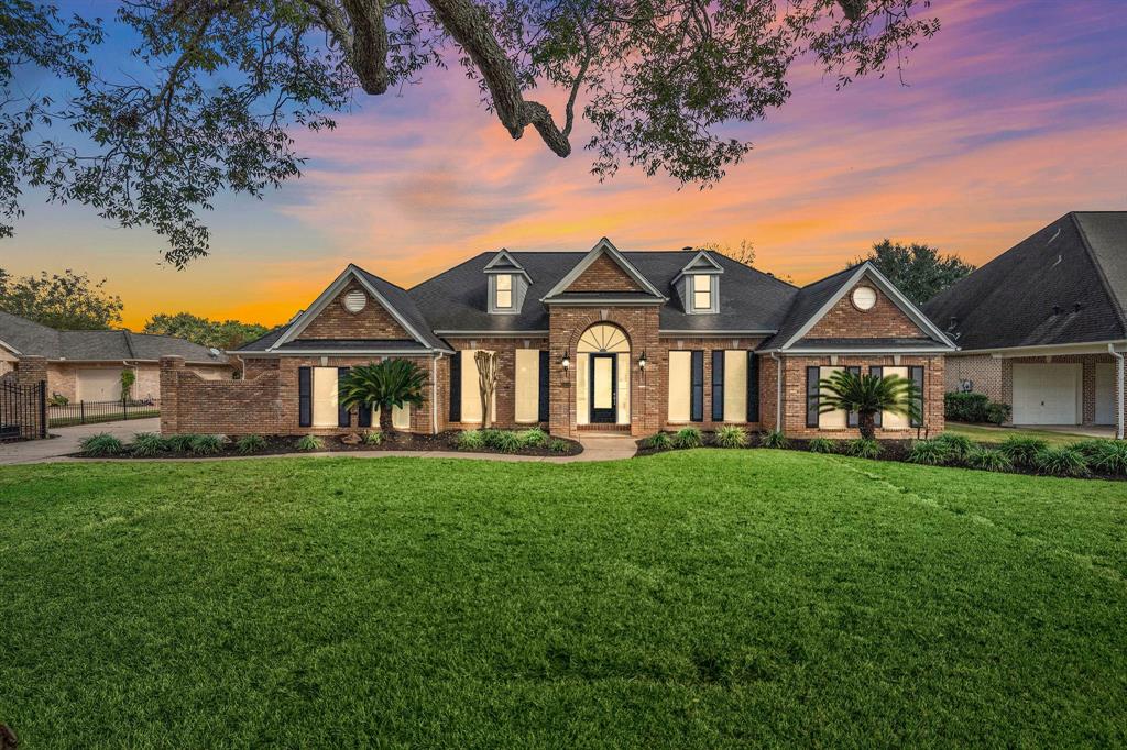 A large house with a lot of grass in front