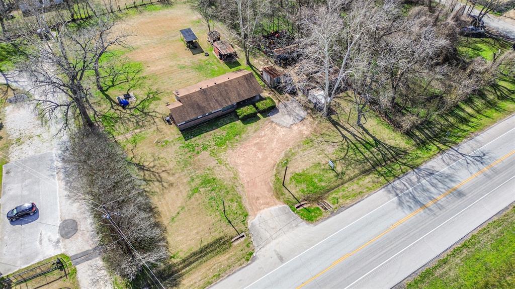 An aerial view of a house and some trees